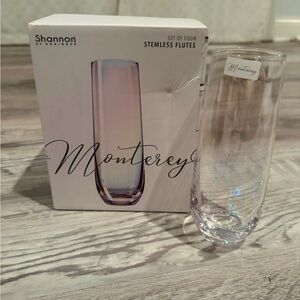 NIB Set of four Shannon by Godinger "Monterey" stemless flutes.